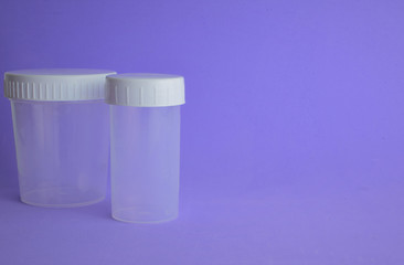 Small laboratory containers, for liquids or other tests. Space for text.
