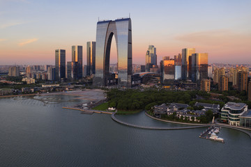 CBD buildings by the lake in Suzhou, China in the morning.