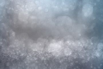 Bokeh effects on silver glittering background
White bokeh effects on blue and silver glittering...