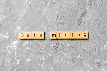 Data mining word written on wood block. Data mining text on cement table for your desing, concept