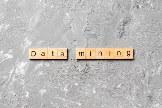 Data mining word written on wood block. Data mining text on cement table for your desing, concept