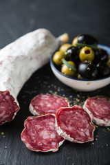 Salami with olives and fresh rosemary
