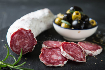 Salami with olives and fresh rosemary