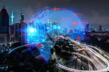 Hologram of Earth planet map on night panoramic cityscape of Kuala Lumpur, Malaysia, Asia. The concept of international companies in KL. Multi Exposure.