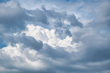 Beautiful blue sky with with light puffy cirrus clouds background