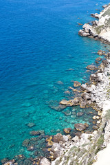 Aerial view of rocks on the sea. Overview of the seabed seen from above, transparent water