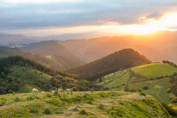 Sunset from Mount Ubieta, with the sun through the clouds