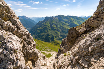 Fototapeta premium Climbing the Karhorn Via Ferrata near Warth Schrocken in the Lechquellen Mountains