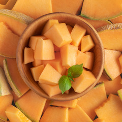 Cantaloupe melon slices close up in a bowl.