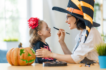 Happy family preparing for Halloween.