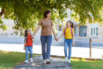 Parent and pupils go to school