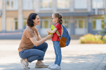 Parent and pupil go to school