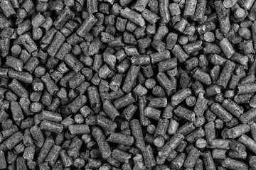 White and black wood pellets texture background. natural pile of wood pellets. organic biofuels....