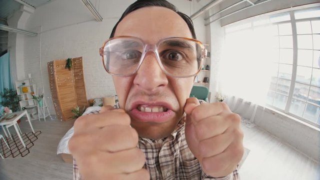 Portrait of funny angry nerd