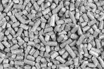 White and black wood pellets texture background. natural pile of wood pellets. organic biofuels. Alternative biofuel from sawdust.
 pile of compressed wood pellets