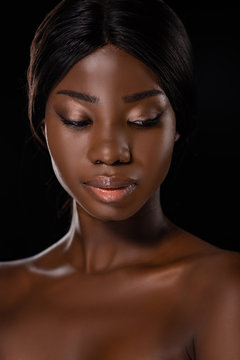 African American Naked Woman Looking Down Isolated On Black