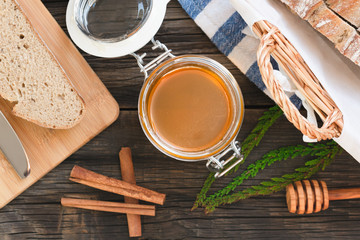 organic honey and rustic bread on a old wooden table. Healthy eating breakfast.