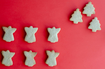 Delicious homemade Christmas cookies on a red background. Traditional holiday baked goods. Top view...