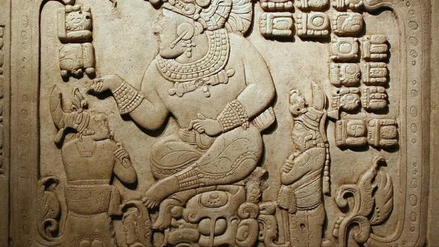 Bas relief depicting a god and people