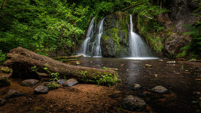 Top Falls at Fairy Glen Nature Reserve. A popular woodland walk with two delightful waterfalls, close to the village of Rosemarkie, in the Scottish Highlands