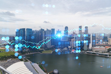 Fototapeta na wymiar Forex and stock market chart hologram over panorama city view of Singapore, the financial center in Asia. The concept of international trading. Double exposure.