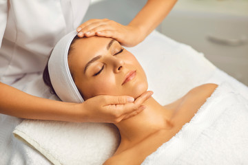 Obraz na płótnie Canvas Facial treatment, massage, skincare, cosmetology concept .Cosmetologist in beauty spa salon