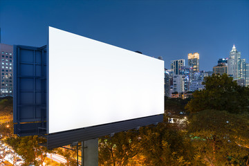 Blank white road billboard with Bangkok cityscape background at night time. Street advertising poster, mock up, 3D rendering. Side view. The concept of marketing communication to sell idea.