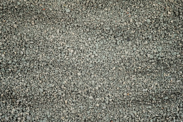 Gray small rocks ground texture. black small road stone background. gravel pebbles stone seamless...
