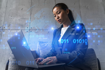 Businesswoman typing on laptop work in modern office on new project. World map drawing hologram. Double exposure. Concept of success.