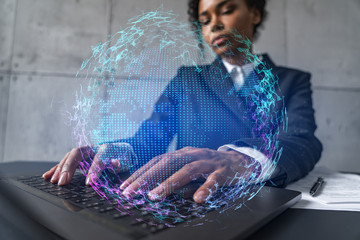 Businesswoman typing on laptop work in modern office on new project. World map drawing hologram. Double exposure. Concept of success.