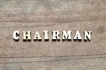 Alphabet letter block in word chairman on wood background