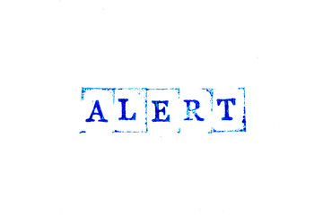 Blue color ink of rubber stamp in word alert on white paper background