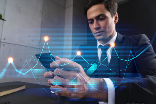 Analyst in office working with Smartphone, Data forecast graph hologram to analyze market behavior, typing phone. Double exposure.