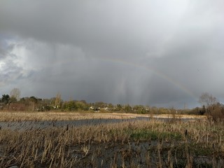 Lake with clouds and rainbow