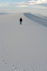 Man who is walking at White Sands National park, NM