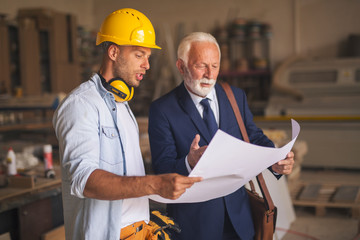 Businessman and contractor talking about new project