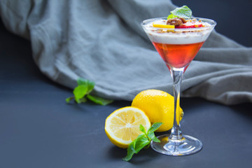 Italian dessert panna cotta with strawberries and lemon