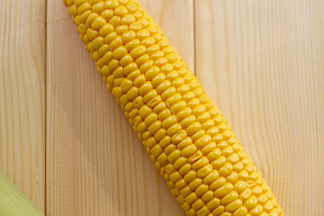 Yellow juicy Kachan corn on a wooden background
