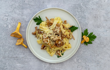 Italian pasta Tagliatelle with chanterelle mushrooms, flatlay