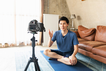 man recording video for video blog