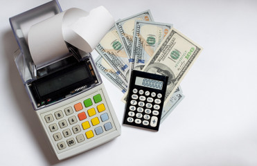 Top view of cash register with check tape, US dollars and calculator isolated on white background, flat lay, copy space