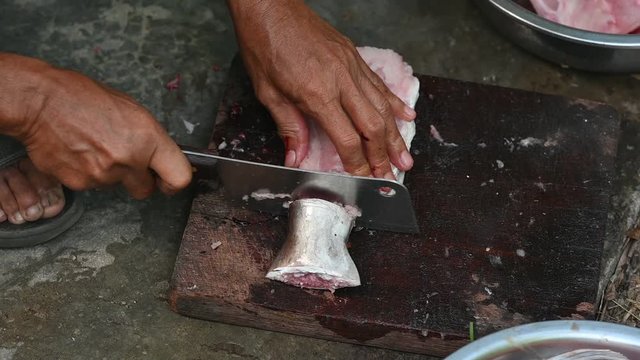 Fishermen are cutting fish for cooking.