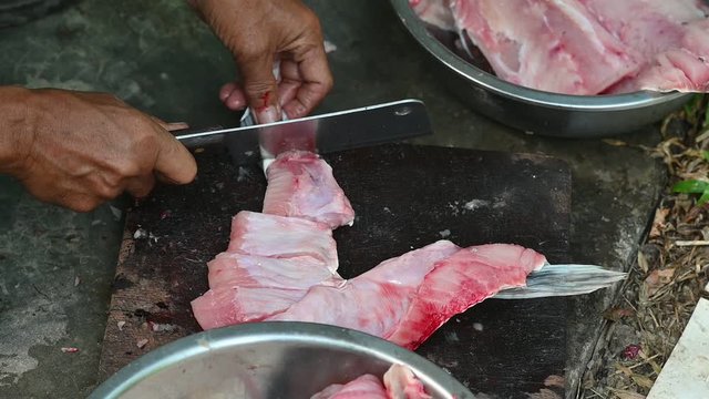 Fishermen are cutting fish for cooking.