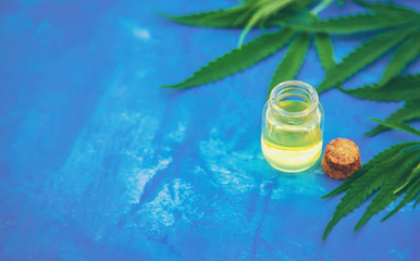 Cannabis extract in a small bottle. Selective focus.