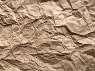 Brown crumpled craft paper background. Old texture eco waste recycling concept