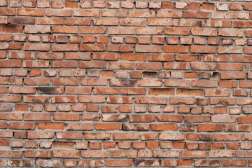 Wall of red bricks. Texture or background of bricks.