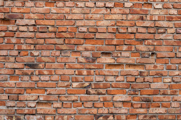 Wall of red bricks. Texture or background of bricks.
