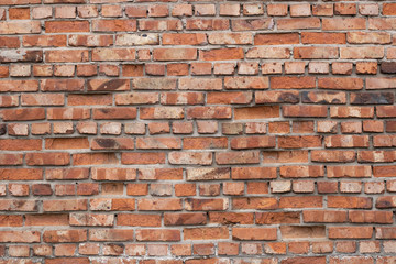 Wall of red bricks. Texture or background of bricks.