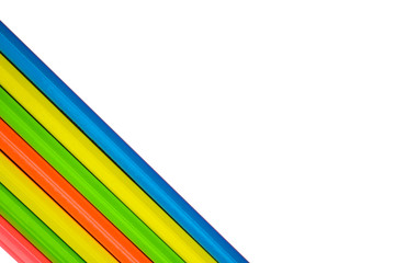 Obraz premium Blue yellow green orange colored wood pencil crayons placed on a white background