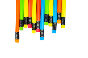 Different colored wood pencil crayons scattered across a white background